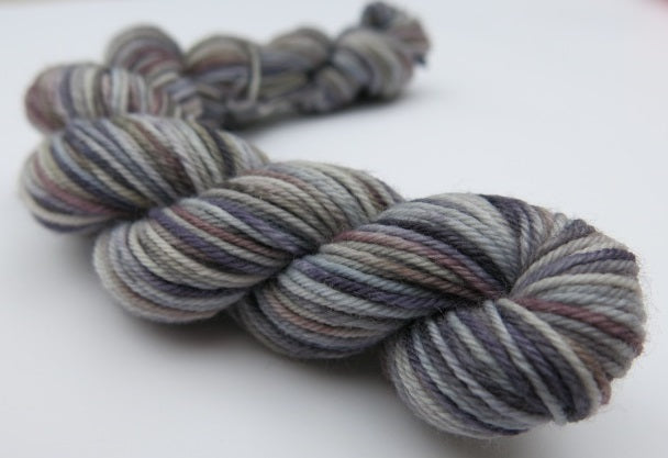 cloudy coloured mini skein with grey with purples and blues
