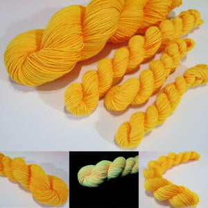hand dyedneon orange yarn fluorescing under uv black light