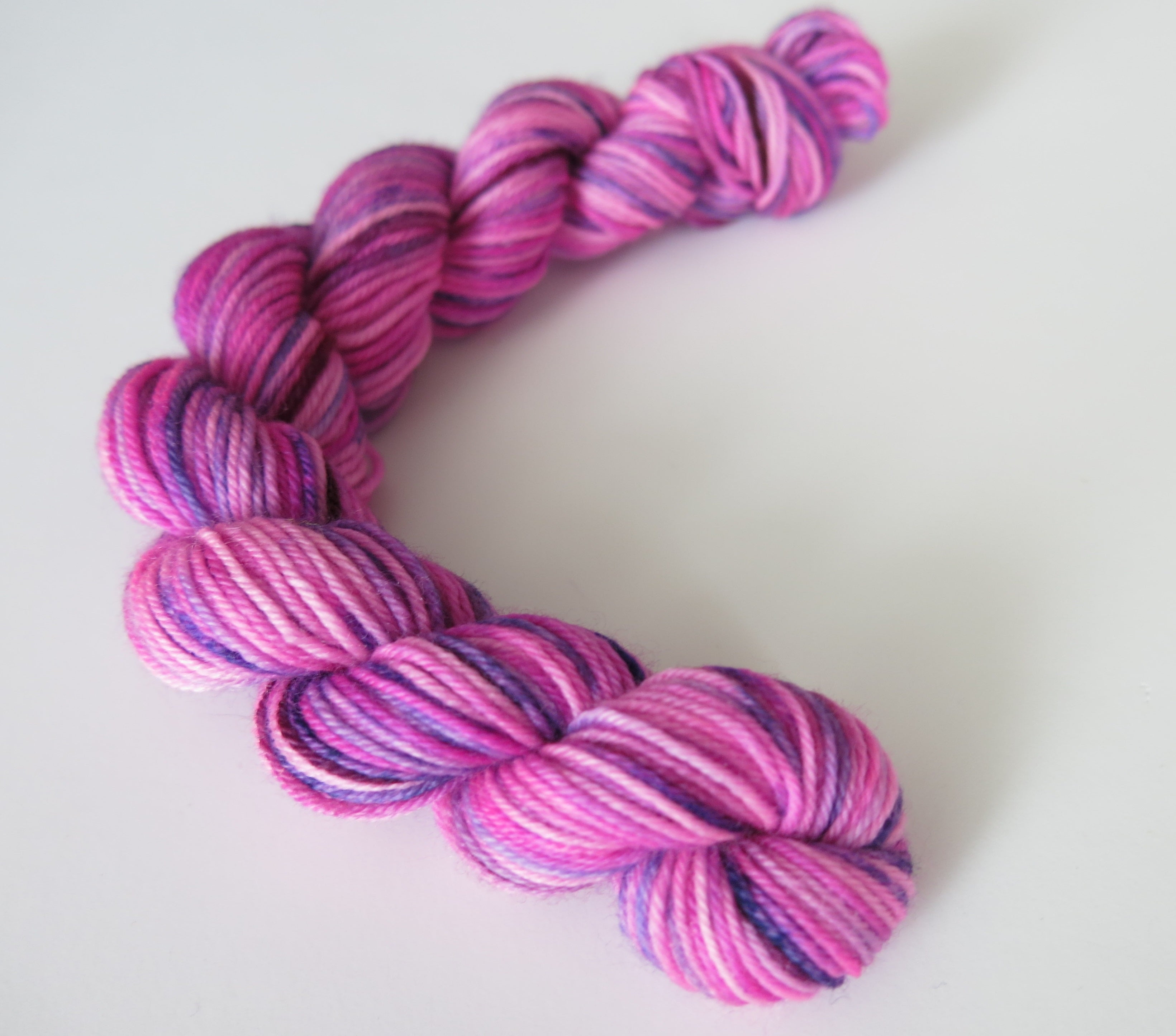 hand dyed 20g sock yarn mini skein in uv pink