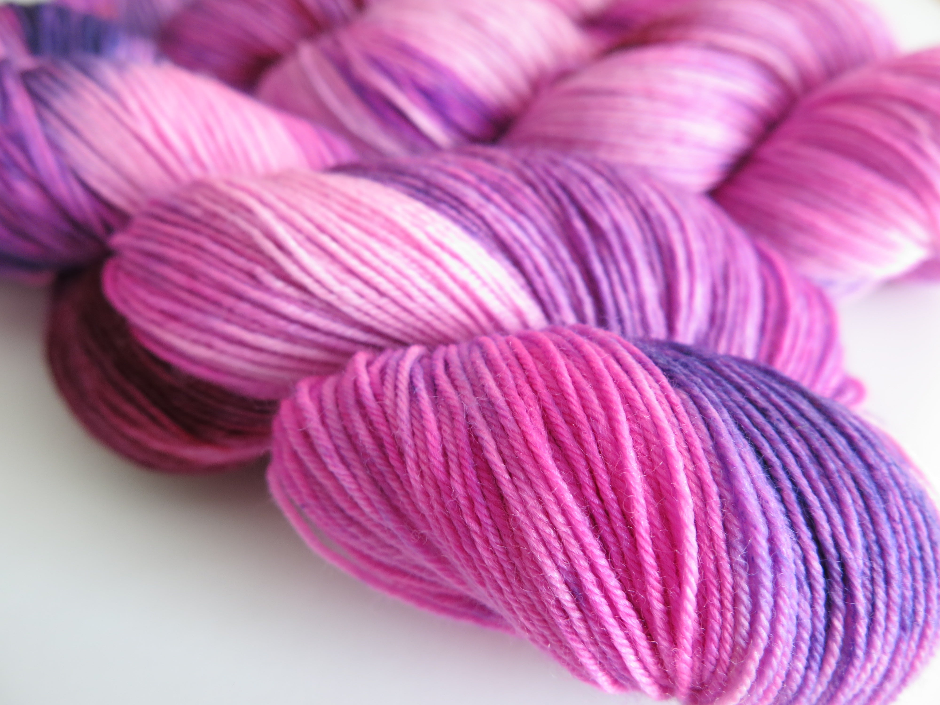 uv reactive pink and purple sock yarn skein for knitting