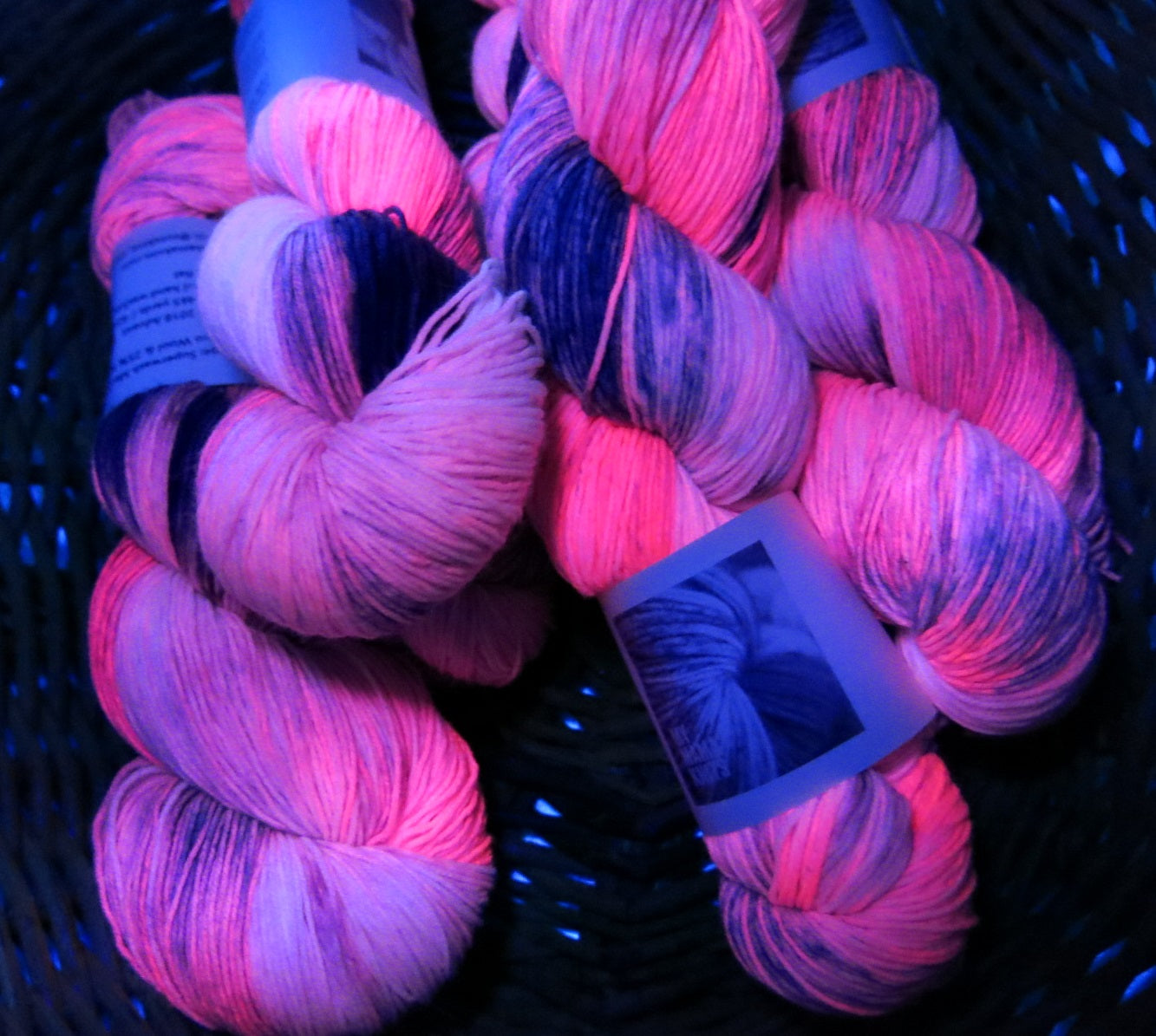 uv reactive pink yarn fluorescing under black light