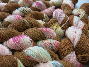 indie dyed brown and pink speckled yarn skeins