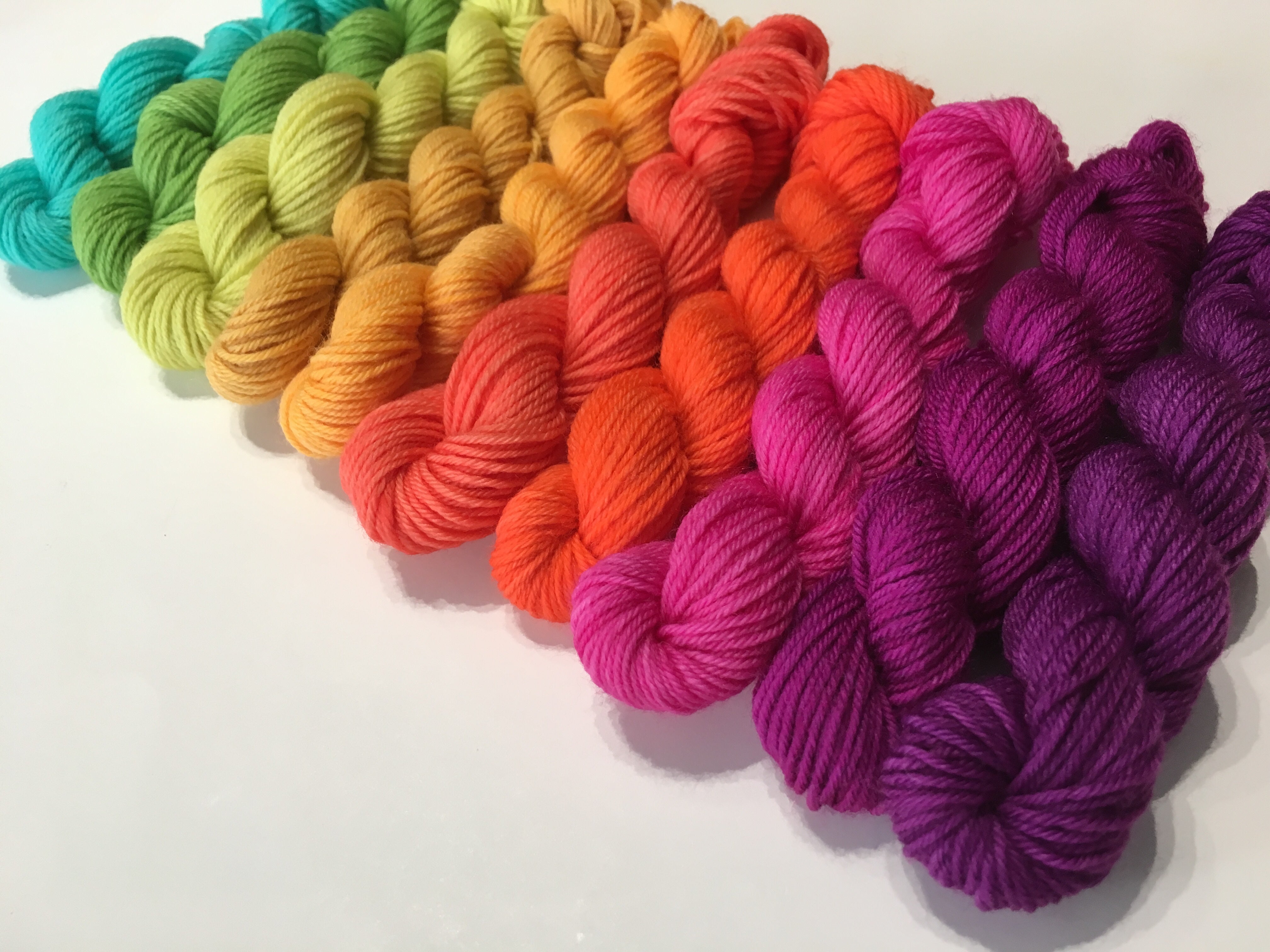 ten 10g sock weight miniskeins in solid rainbow colours