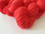 hand dyed ruby red merino sock yarn skeins