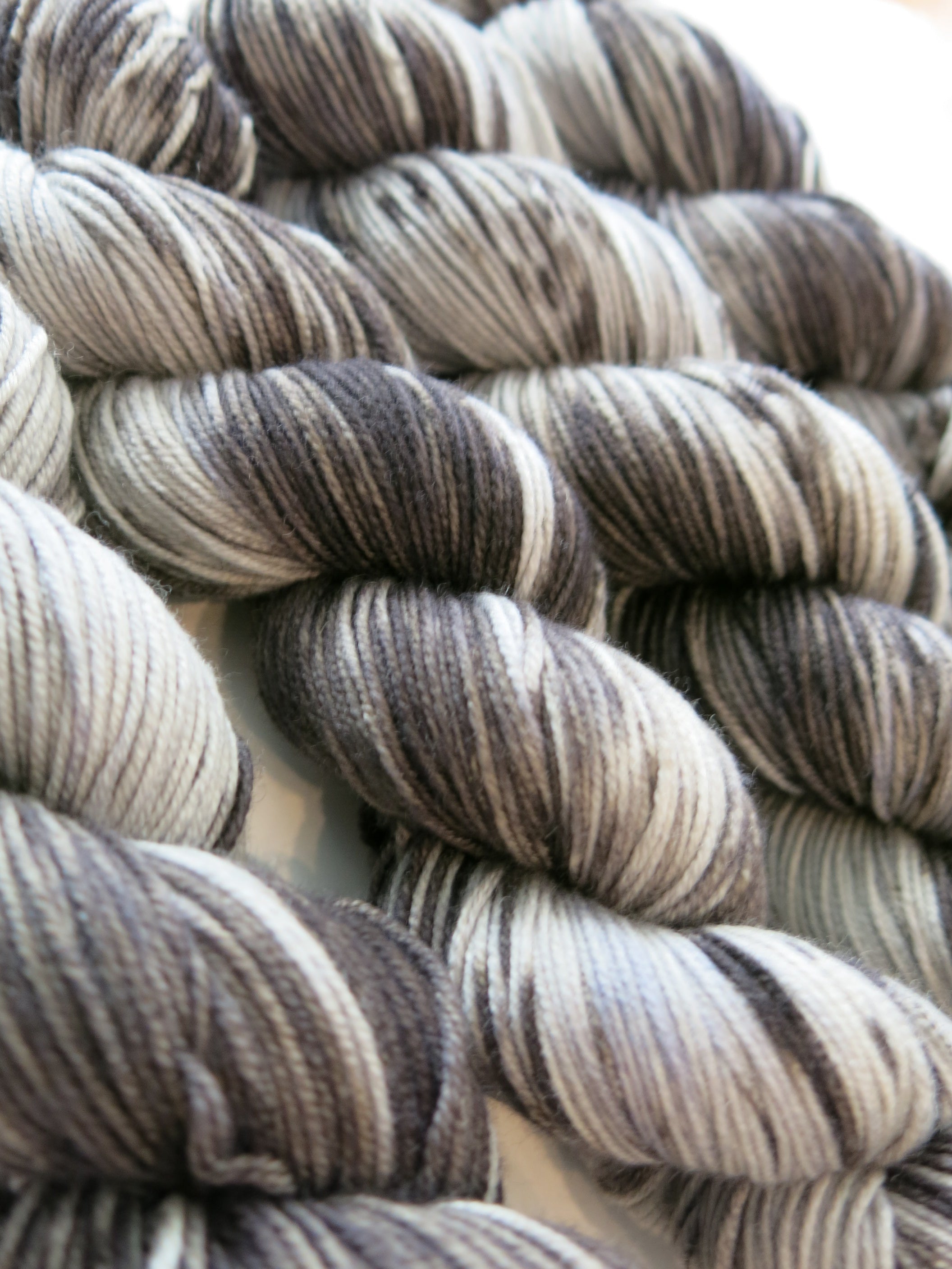 hand dyed tonal black and grey merino yarn skeins
