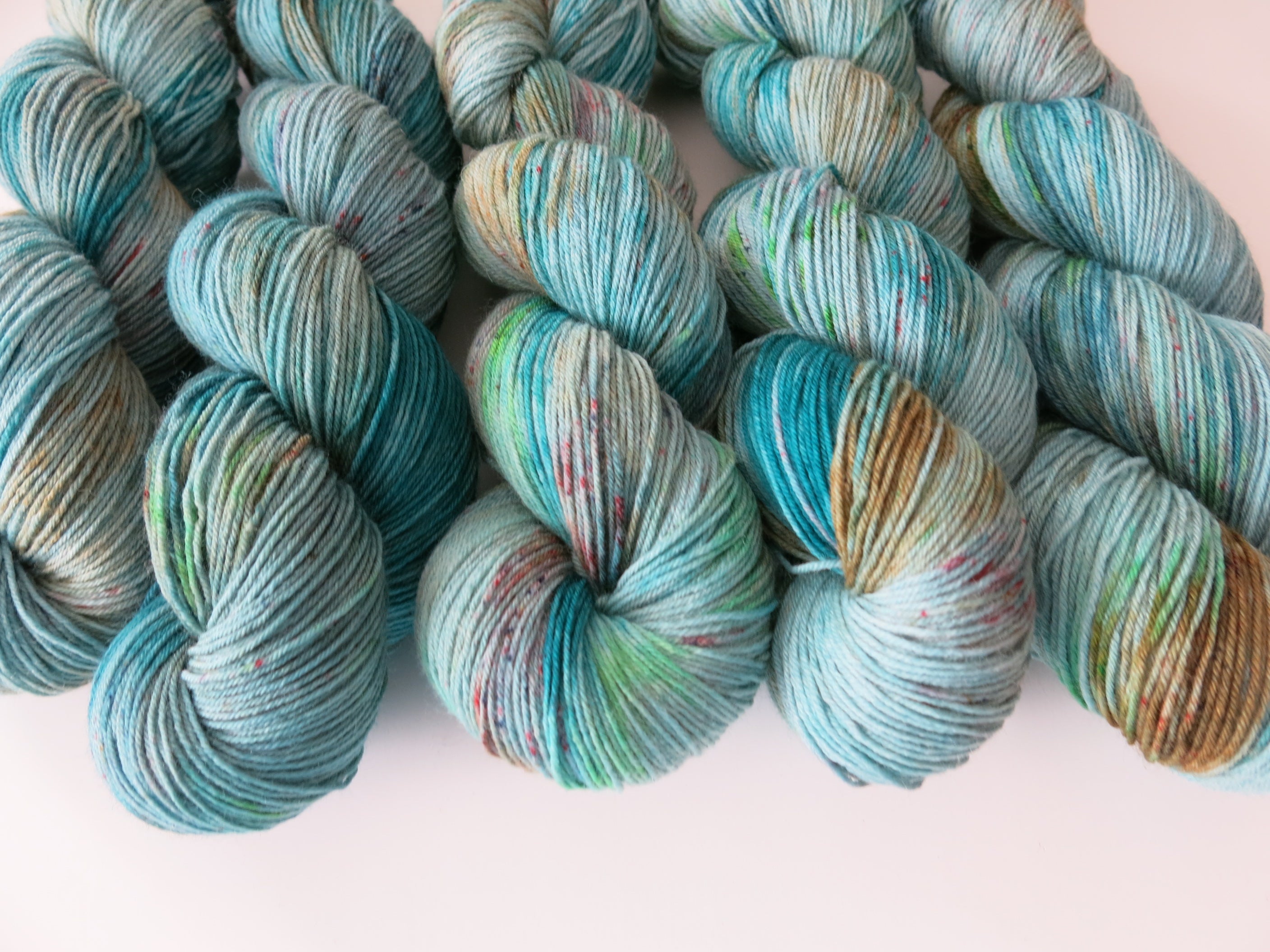 siren indie dyed speckled blue sock yarn skein