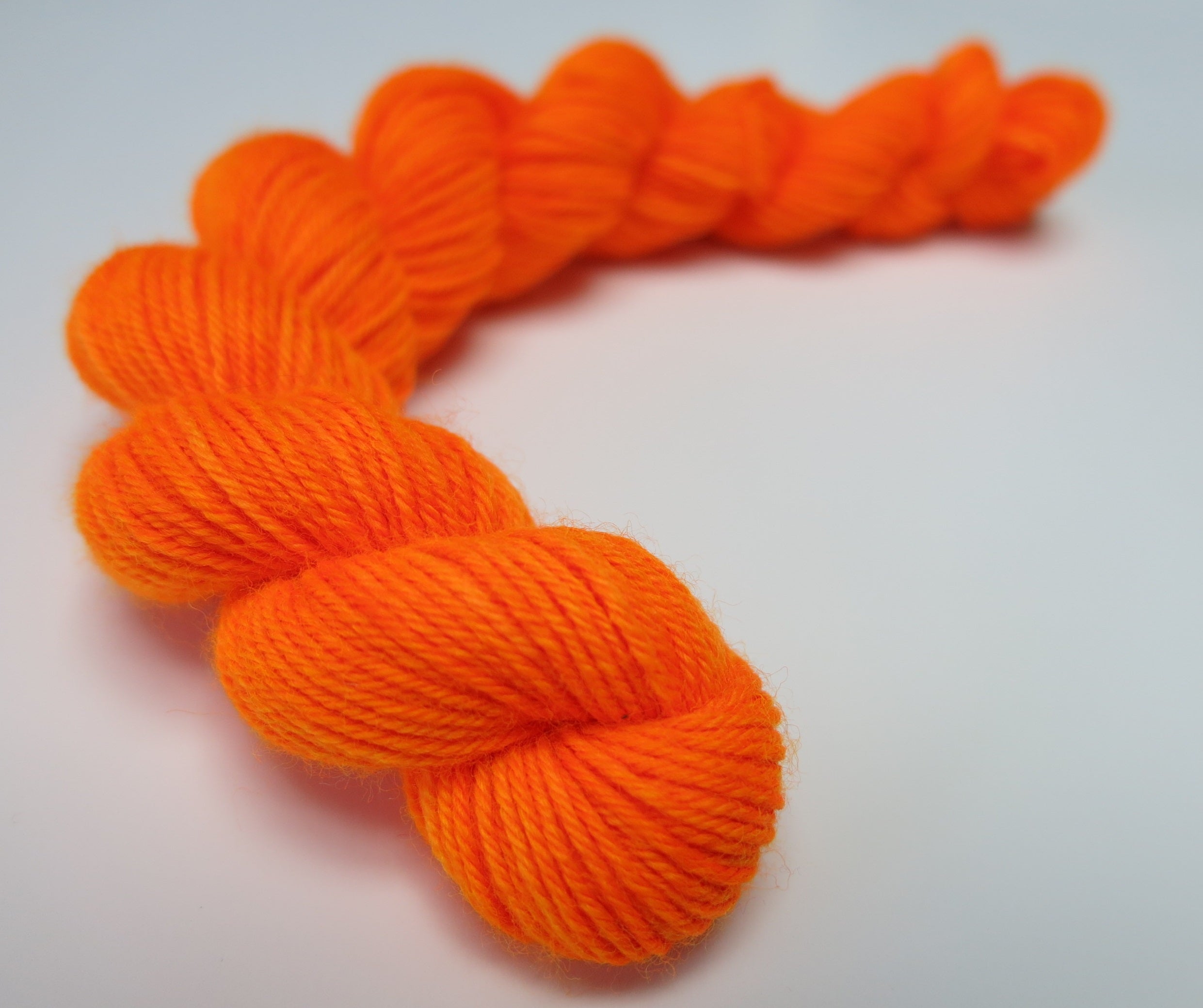 hand dyed orange uv reactive sock yarn mini skein