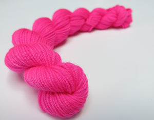 hand dyed pink uv reactive sock yarn mini skein