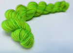 hand dyed uv reactive green sock yarn