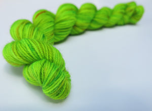 hand dyed uv reactive green sock yarn