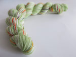hand dyed green speckled sock yarn mini skein