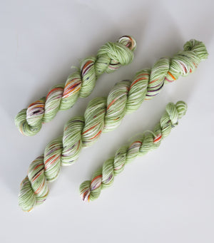 indie dyed green speckled sock yarn mini skein