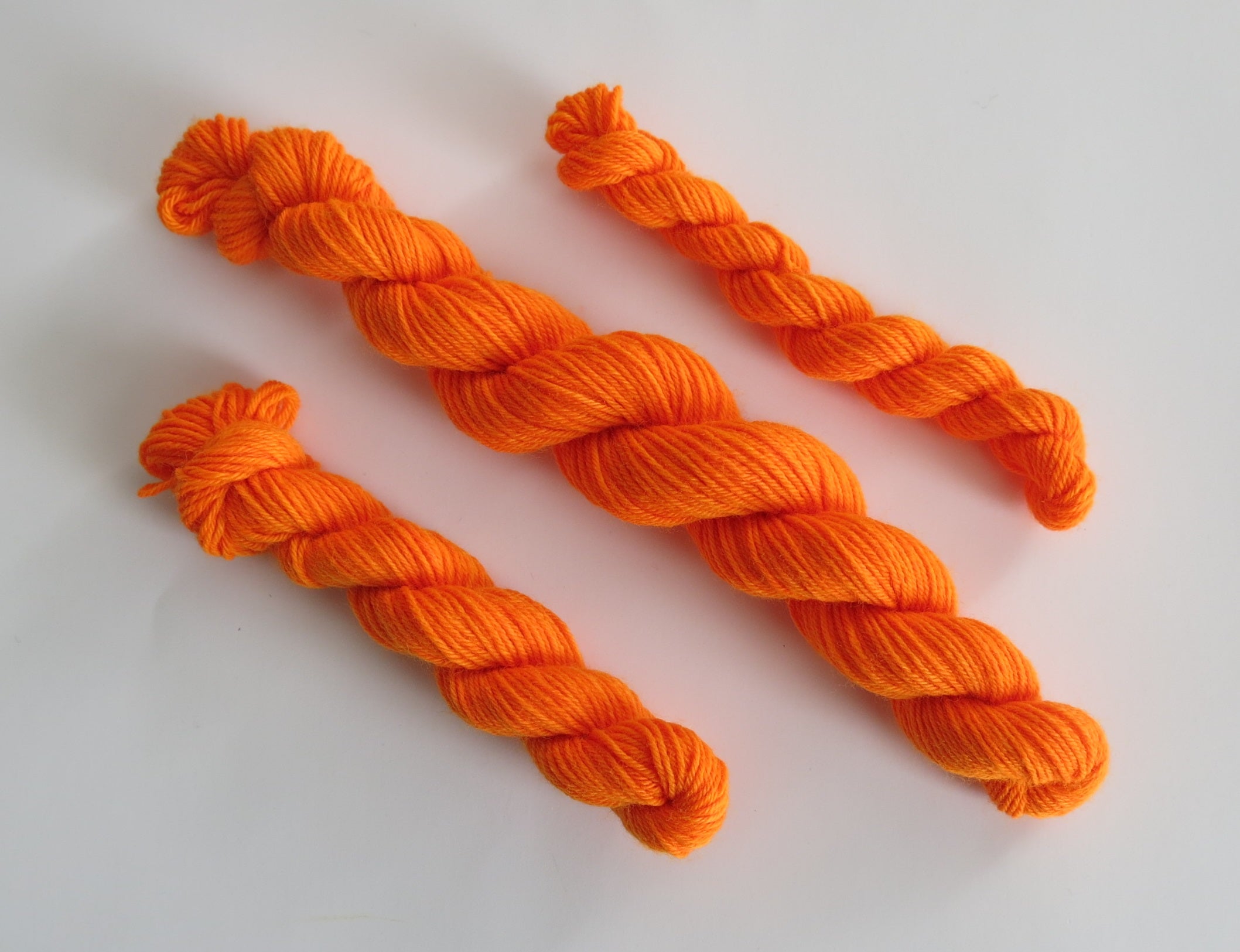 hand dyed orange uv reactive sock yarn mini skein