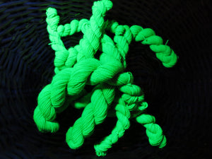 hand dyed green uv reactive mini skein under black light