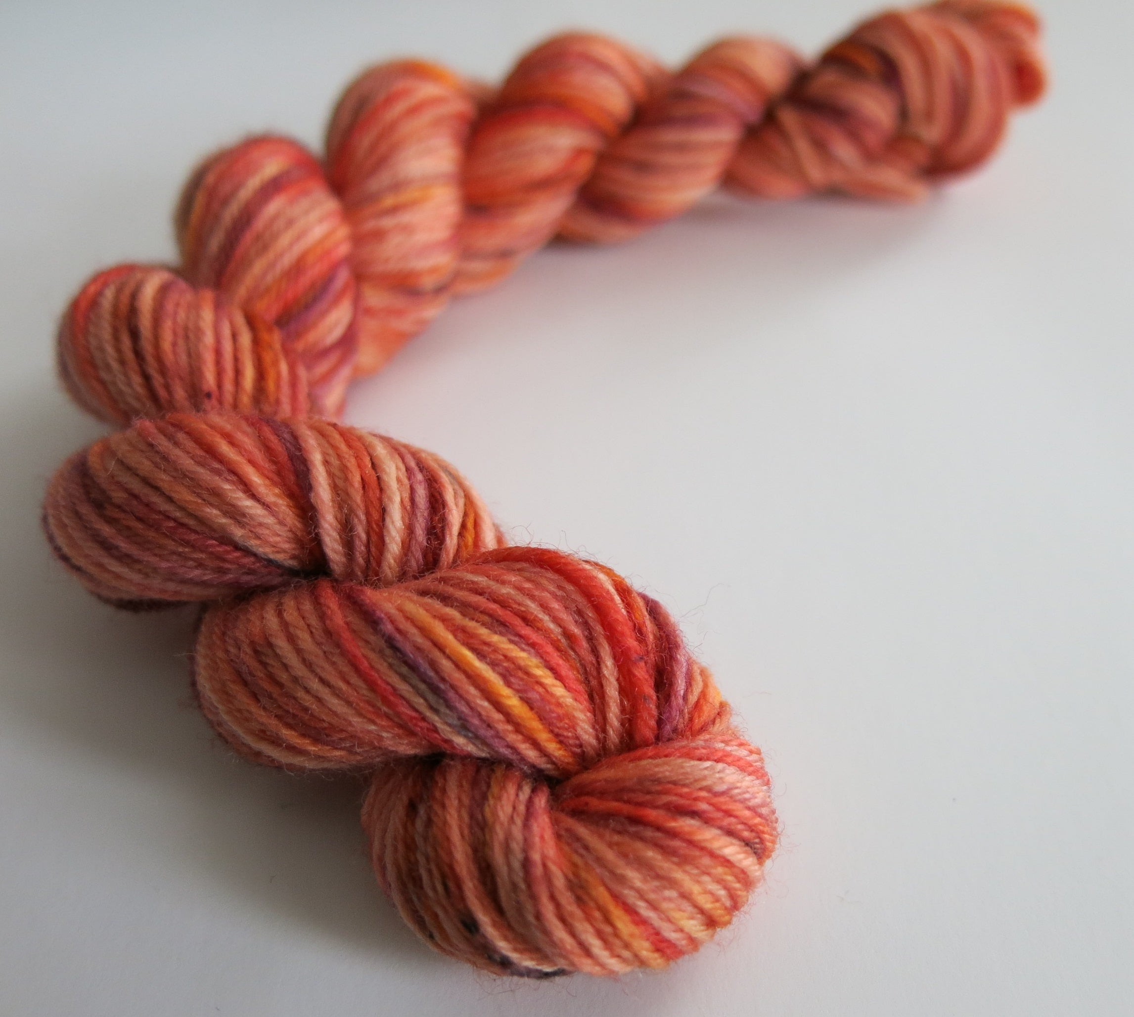 hand dyed orange speckled sock yarn