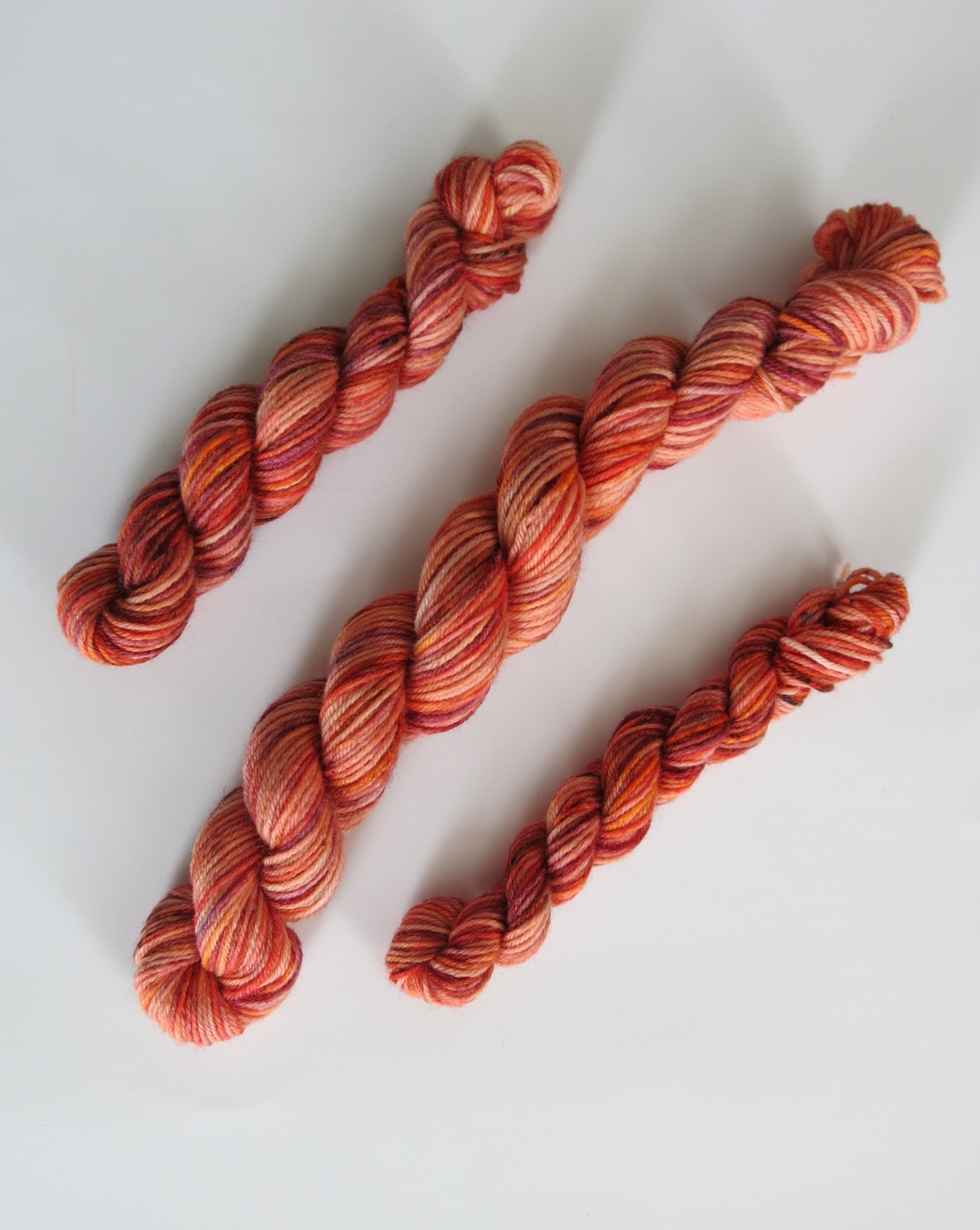 indie dyed uv reactive orange speckled sock yarn