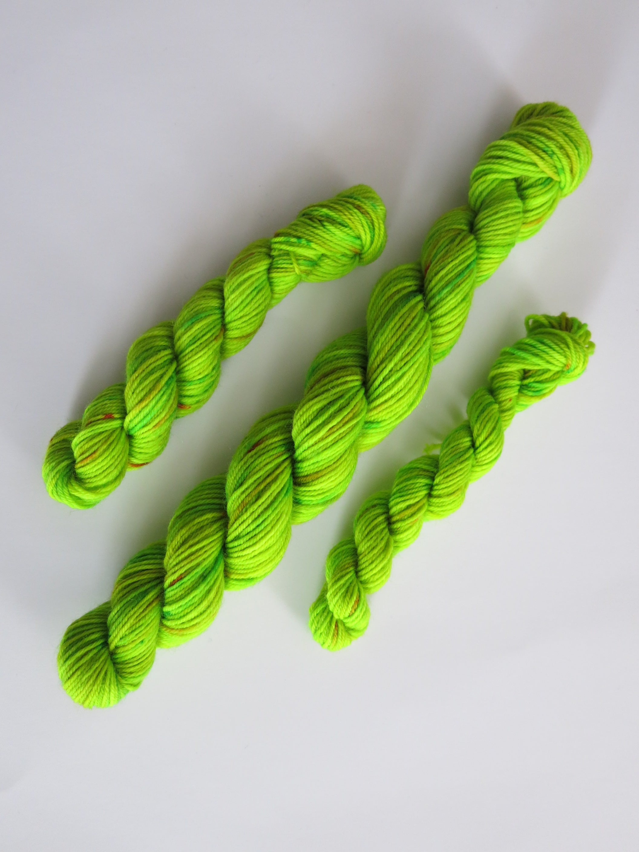 hand dyed uv reactive green sock yarn