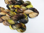 hand dyed green and brown sock yarn skeins