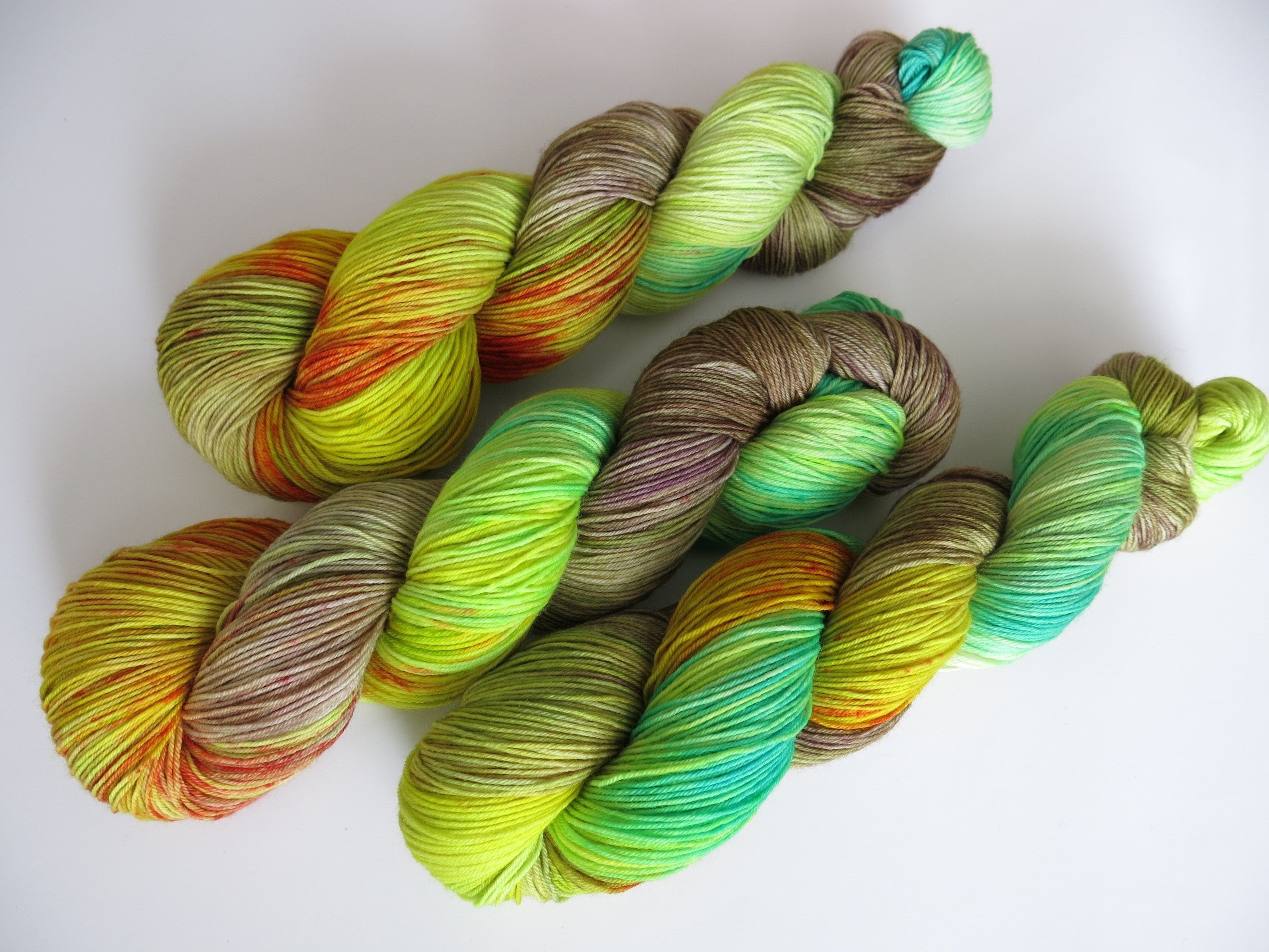 ooak hand dyed speckled yarn skeins in green and brown