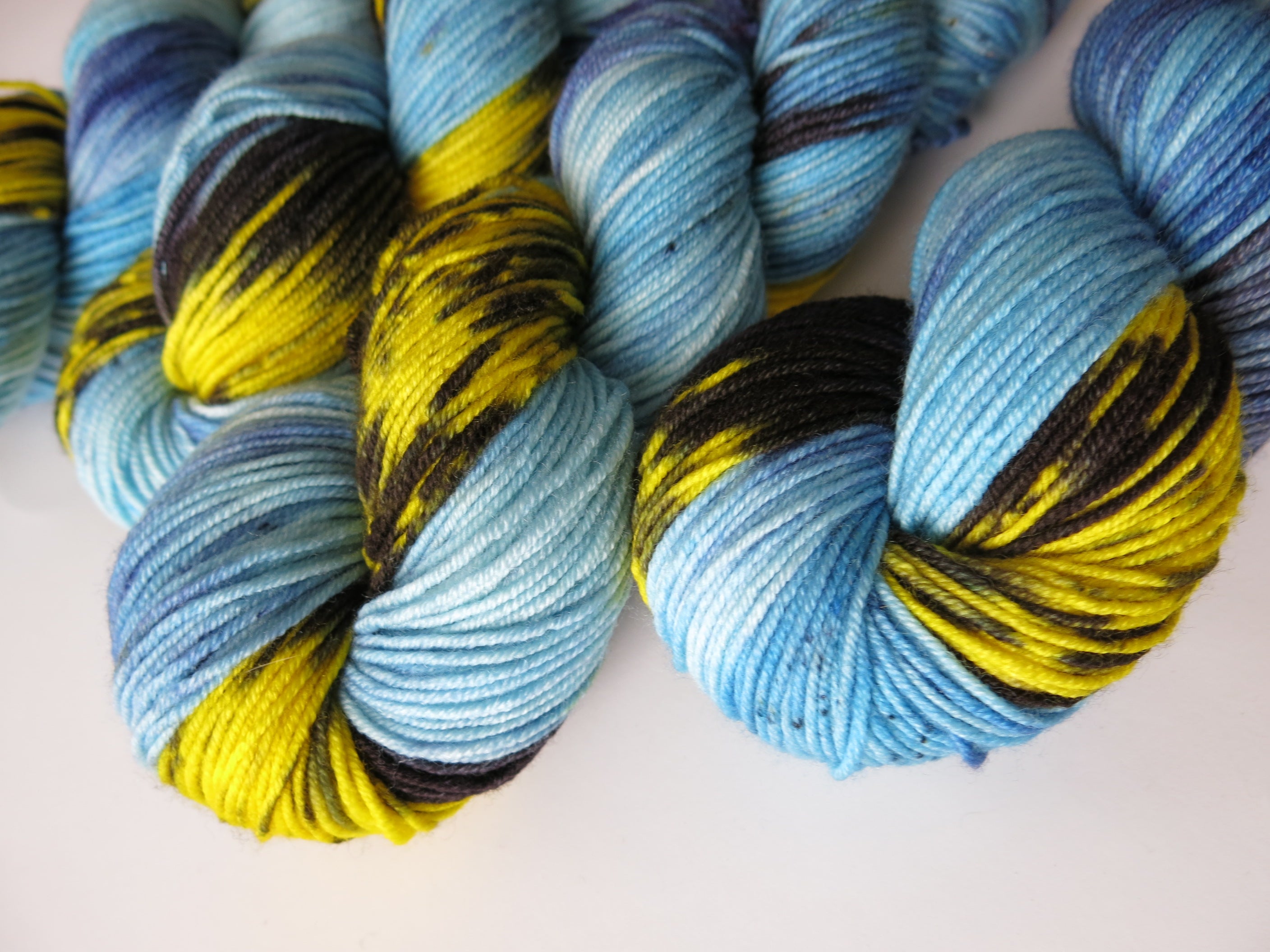 hand dyed 8 ply superwash merino yarn skeins