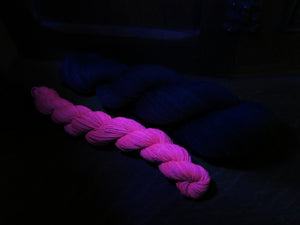 indie dyed black light responsive purple sock yarn skein
