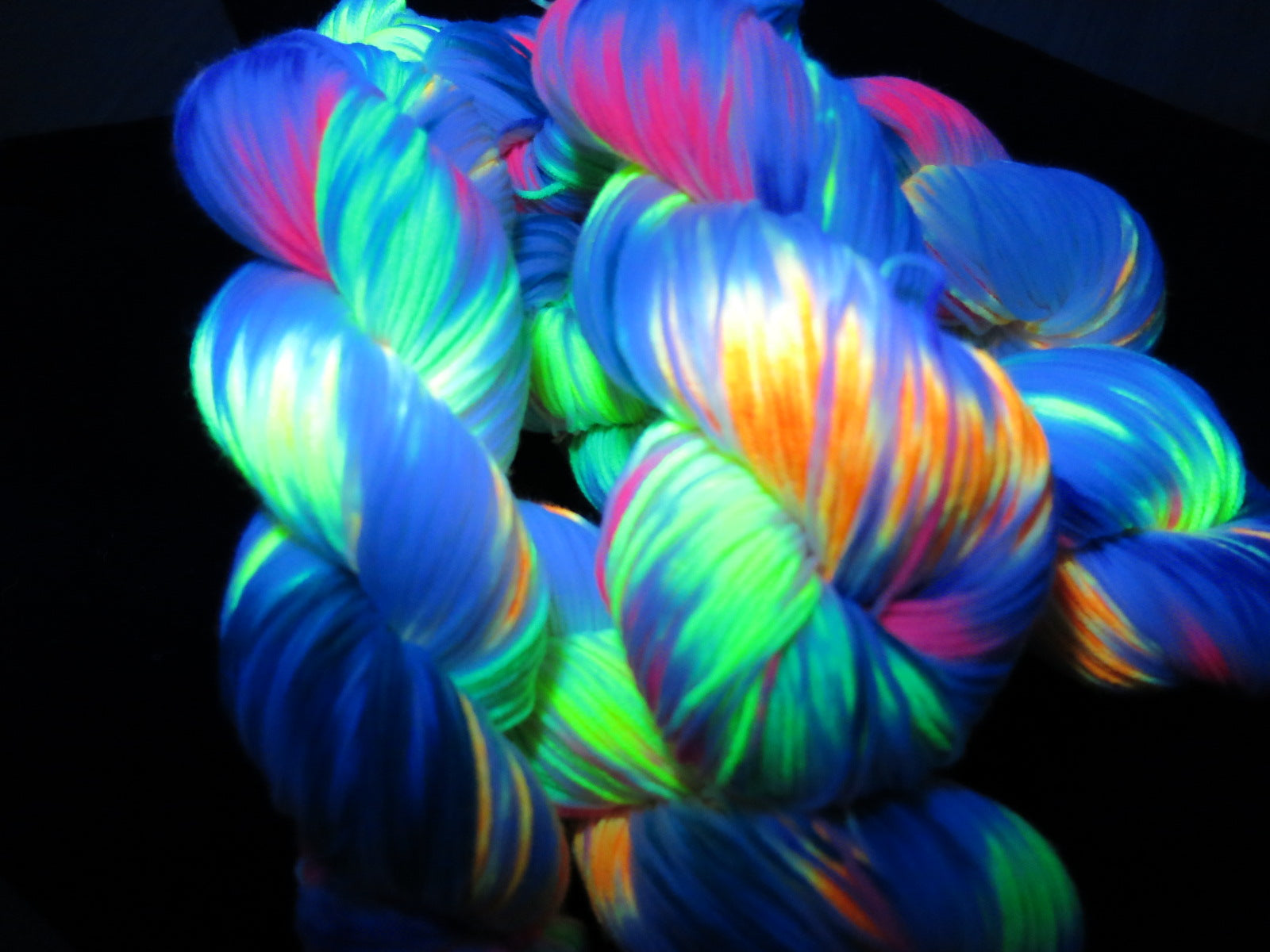 hand dyed uv reactive yarn under black light for knitting