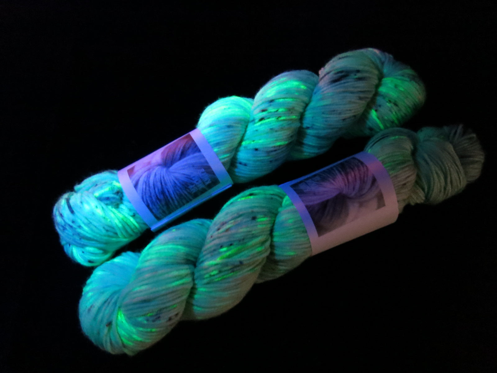 uv reactive green merino yarn fluorescing under black light
