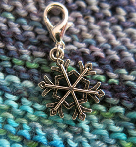 silver snowflake hanging charm with a lobster clasp