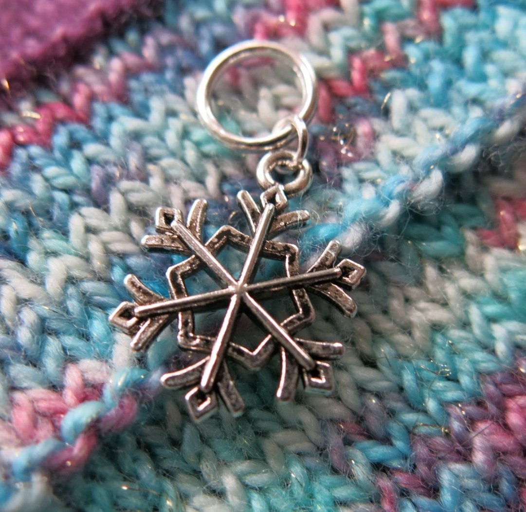 silver snowflake charm on a snagless ring for knitting