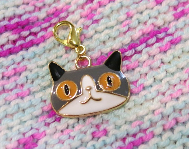 enamel cat charm on a hanging lobster clasp for progress keeping