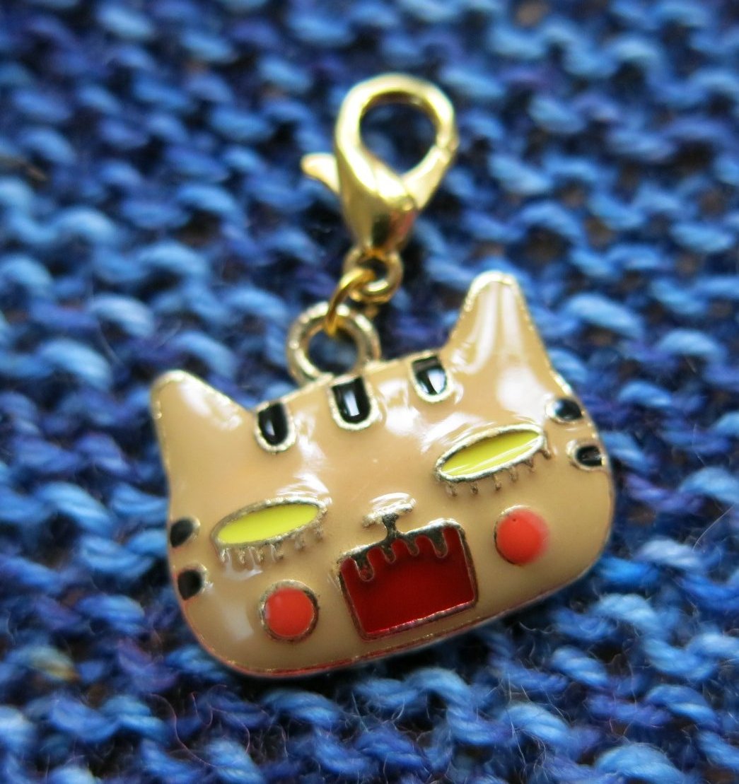 angry cat charm on a hanging clasp for progress keeping and bags