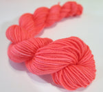 neon coral uv reactive 20g mini yarn skein for knitting and crochet