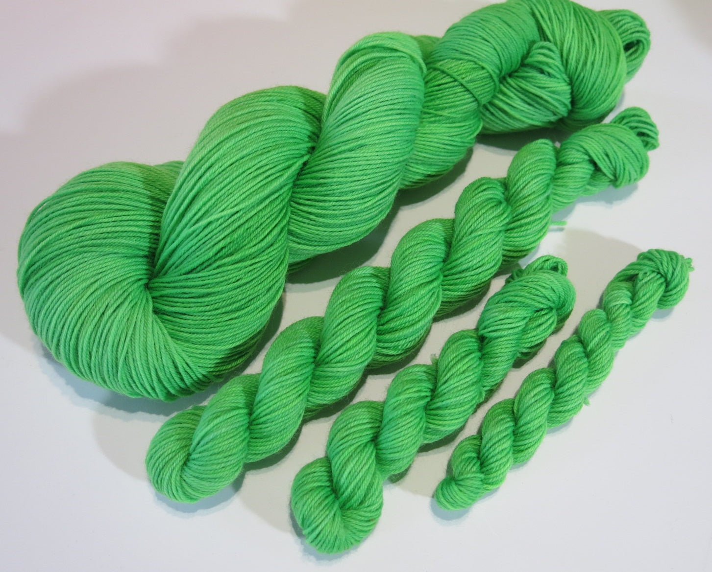 solid green sock yarn skeins for knitting and crochet