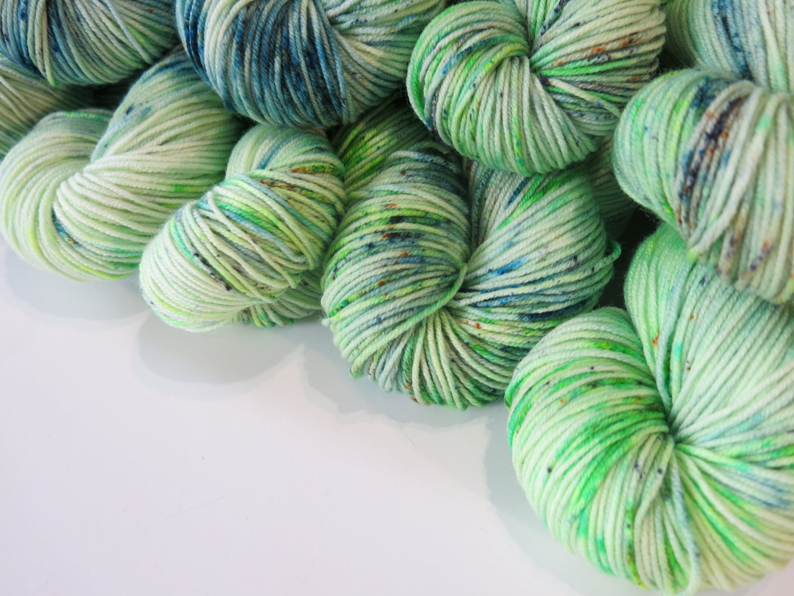 green indie dyed yarn on patsy by my mama knits