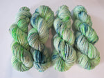 superwash aran merino in uv reactive green for knitting and fibre crafts