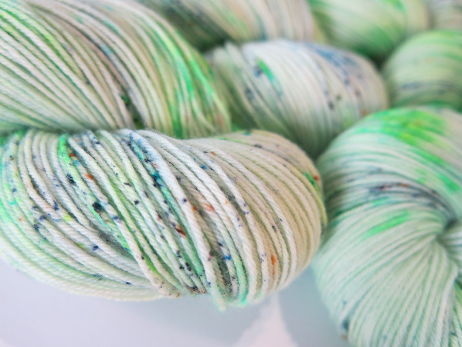 light neon green sock yarn skeins by my mama knits