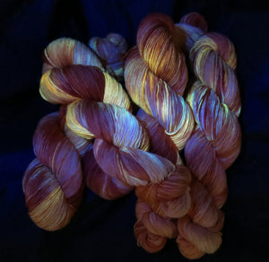 uv reactive orange yarn fluorescing under black light