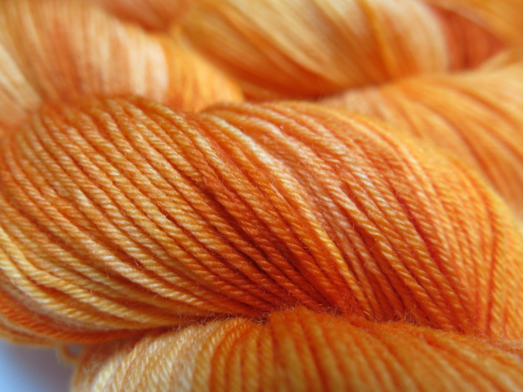 tonal orange merino wool sock yarn for knitting and crochet