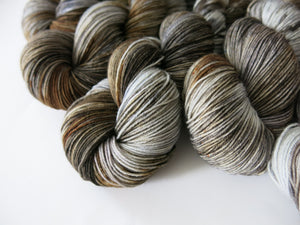 kettle dyed brown and gray superwash merino sock yarn skeins