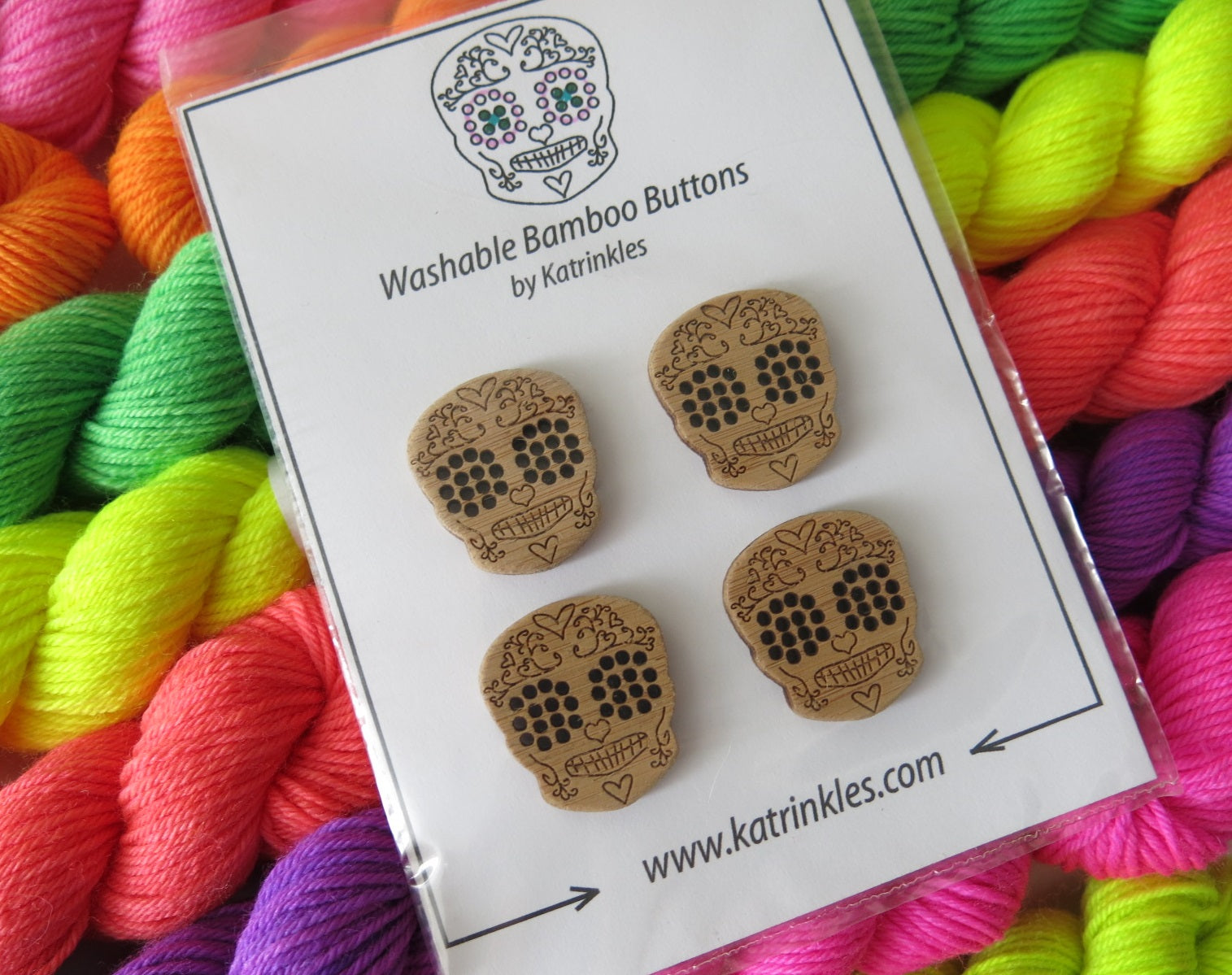 1 inch wooden sugar skull buttons by katrinkles on uv reactive neon yarn