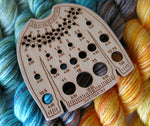 wooden sweater shaped knitting needle gauge with a stitchable yoke