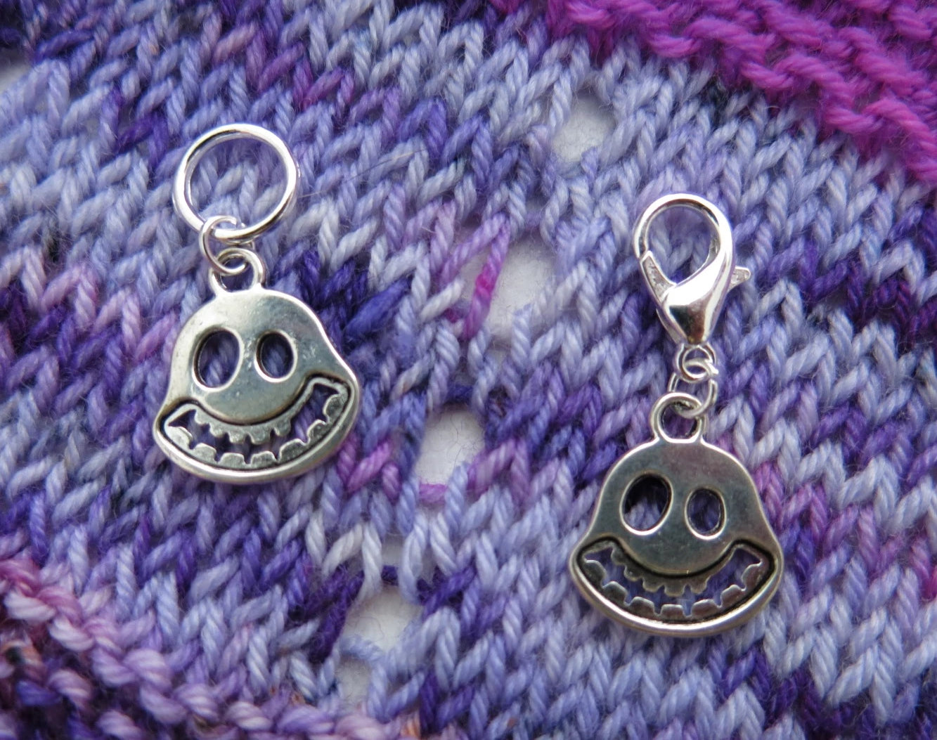 silver coloured smiling ghost face charms on lobster clasps for knitting and crochet