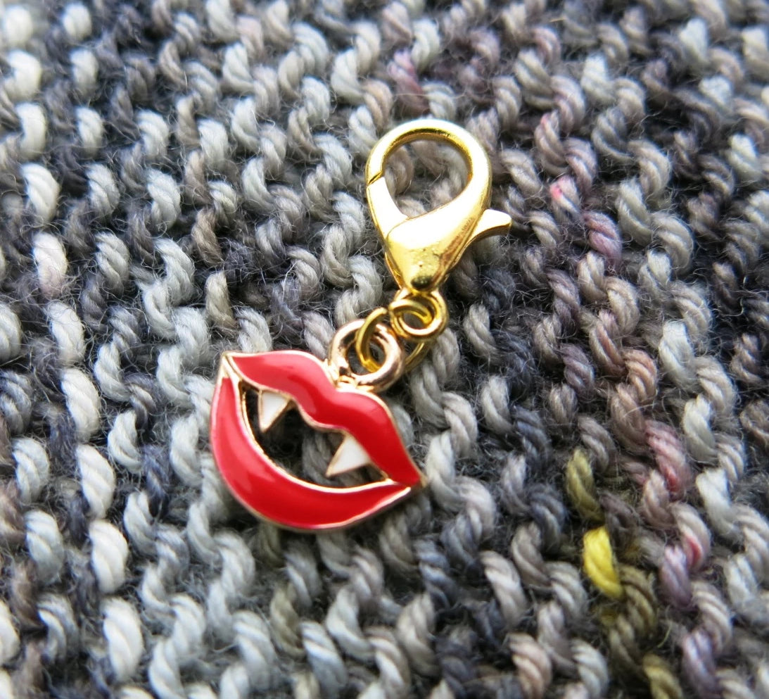 red enamel vampire lip charm on a lobster clasp for knitting and crochet