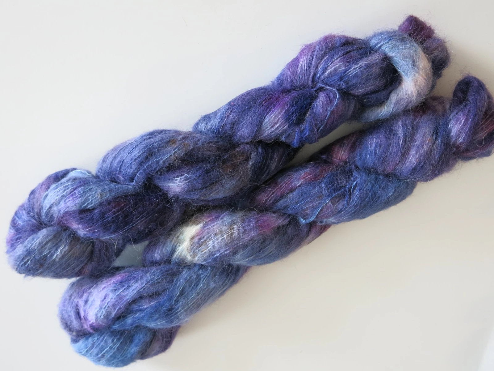 dark blue and purple suri alpaca and silk lace weight yarn skeins