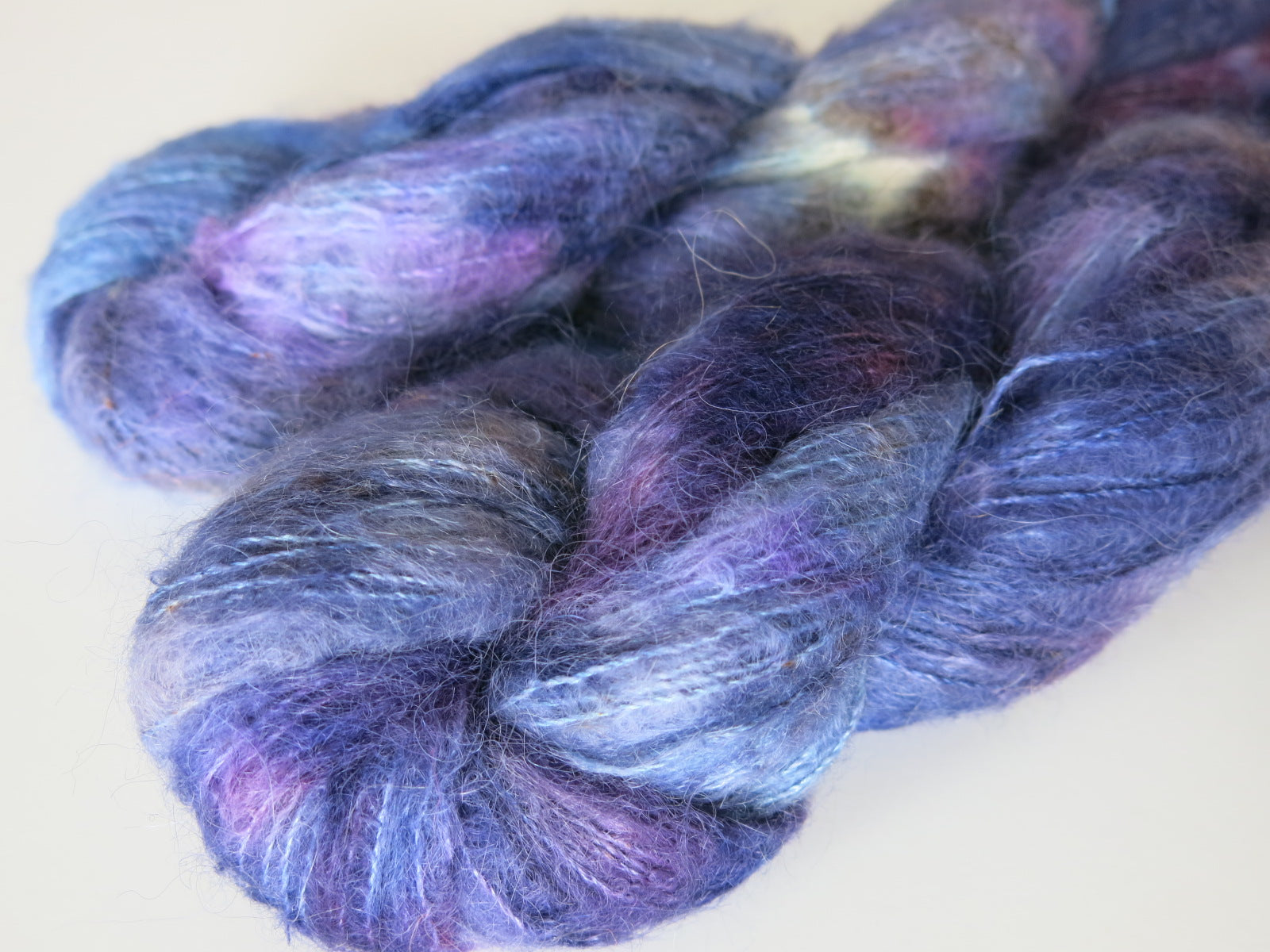 dark blue and purple suri alpaca and silk lace weight yarn skeins