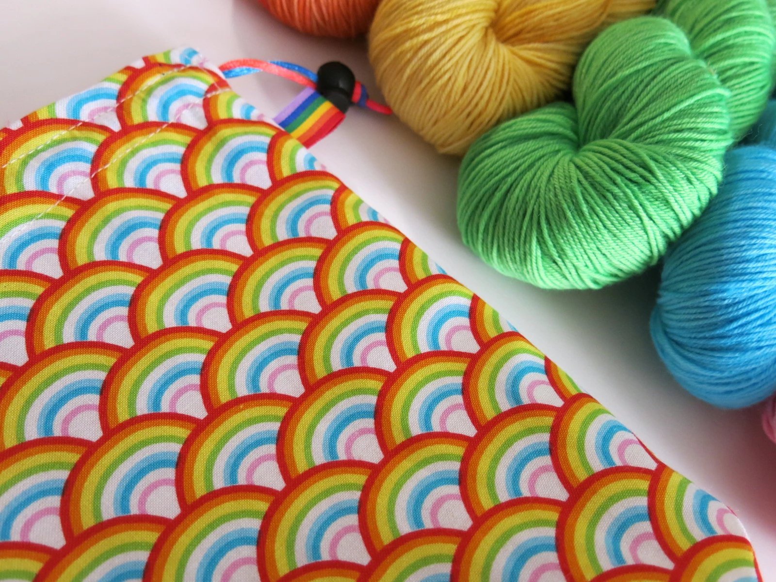 cotton drawstring knitting project bags with a rainbow print