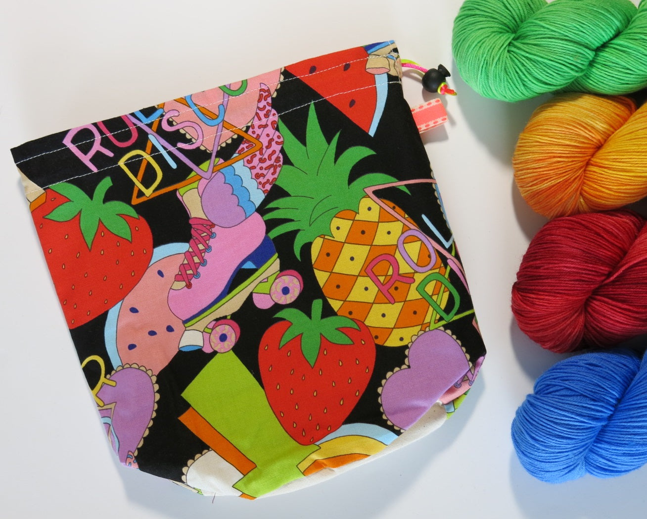 colourful cotton knitting project bag with rollerskates and pineapples