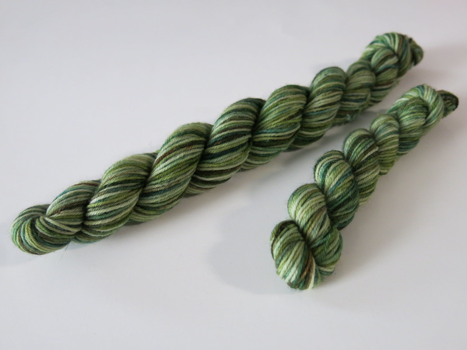 vareigated forest green and brown sock yarn mini skeins