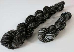 black merino sock yarn skeins with hints of dark grey