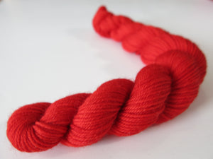 bright solid red sock yarn mini skein for knitting and crochet